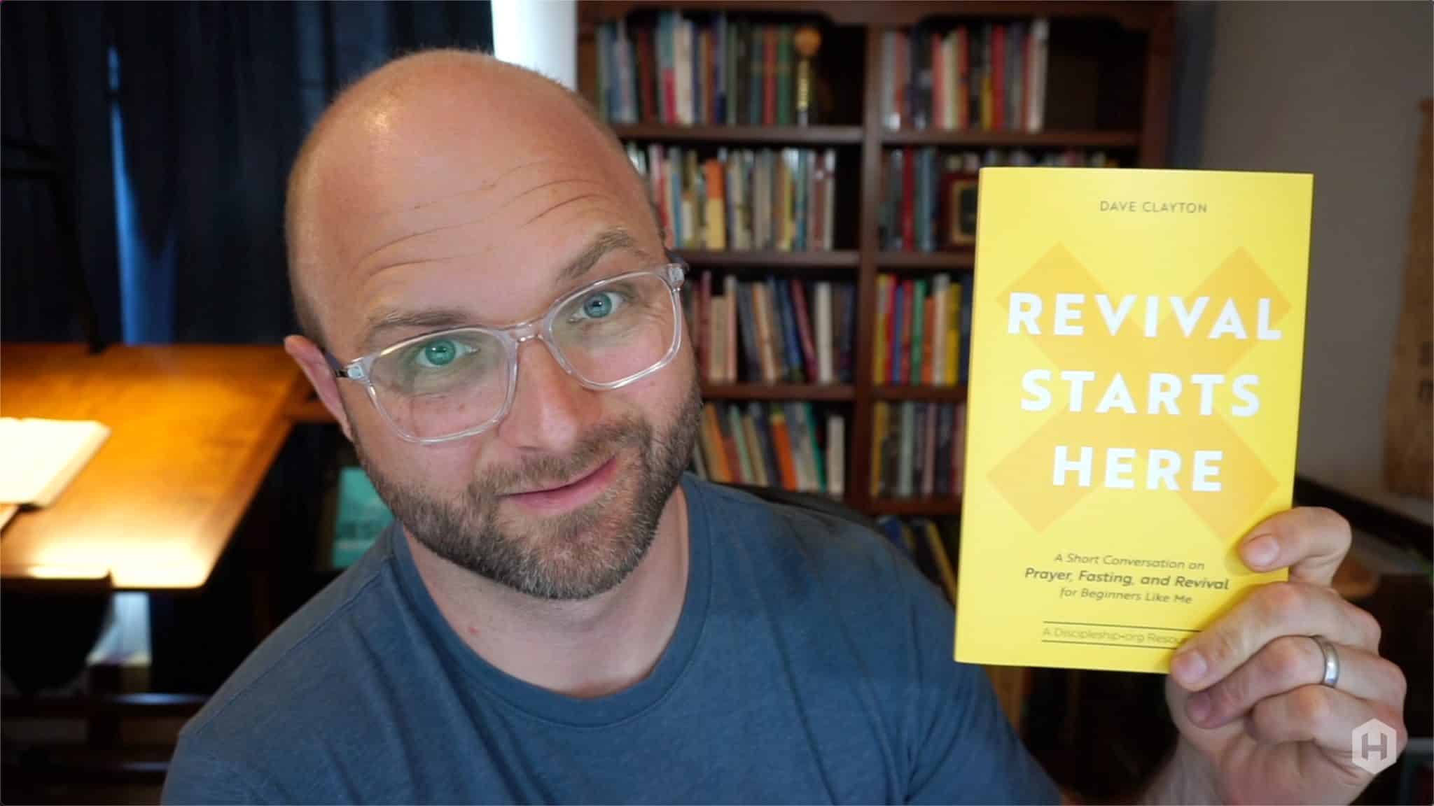 Chad holding Revival Starts Here, a book on prayer
